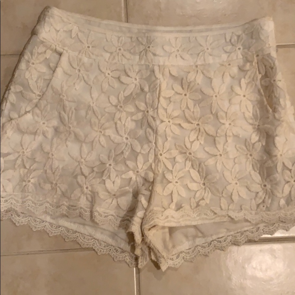 Adorable floral short with lace lining.